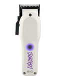 White hair clipper with purple branding on a white background
